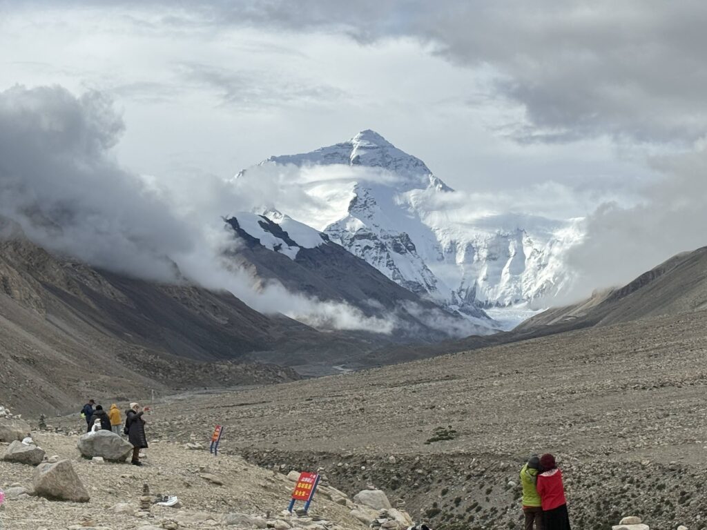 a view of a city and mountains from a distance