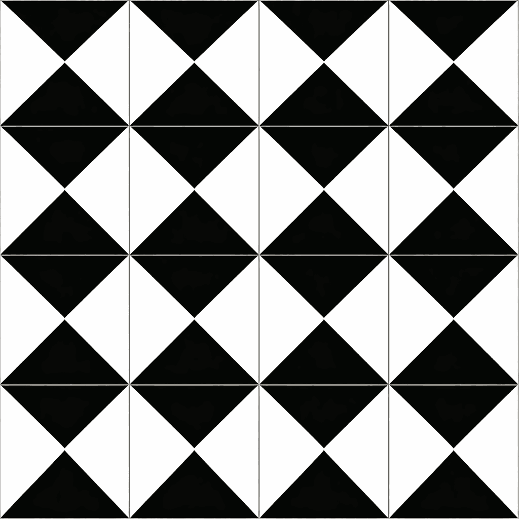 Hand holding an open book beside a laptop and coffee cup.