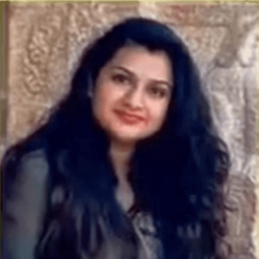 a person sitting at a table looking at the phone