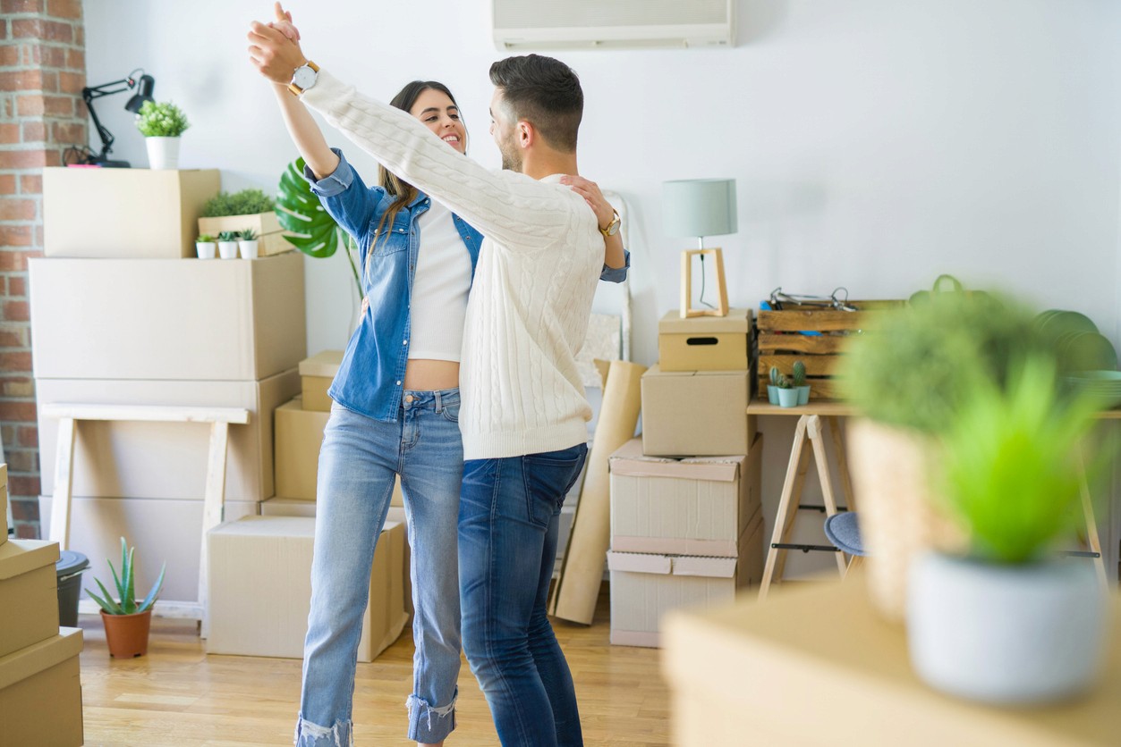 Young couple moving into new house