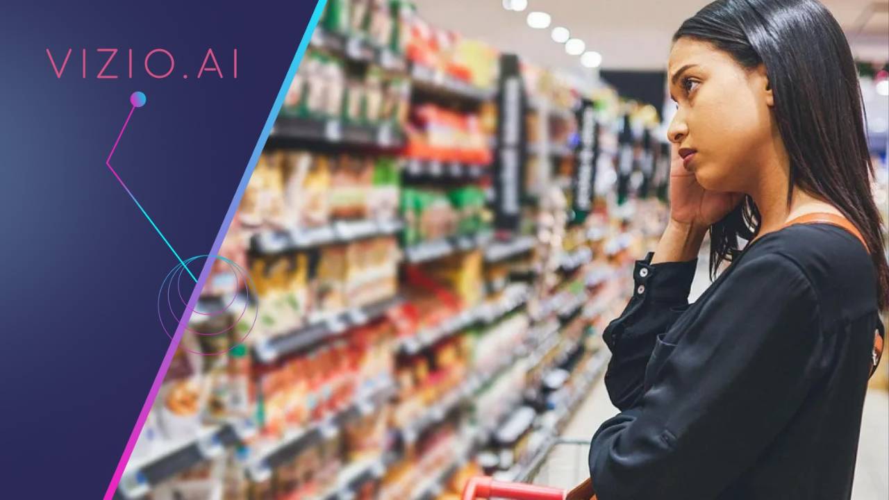 Woman shopping along a stocked supermarket aisle.