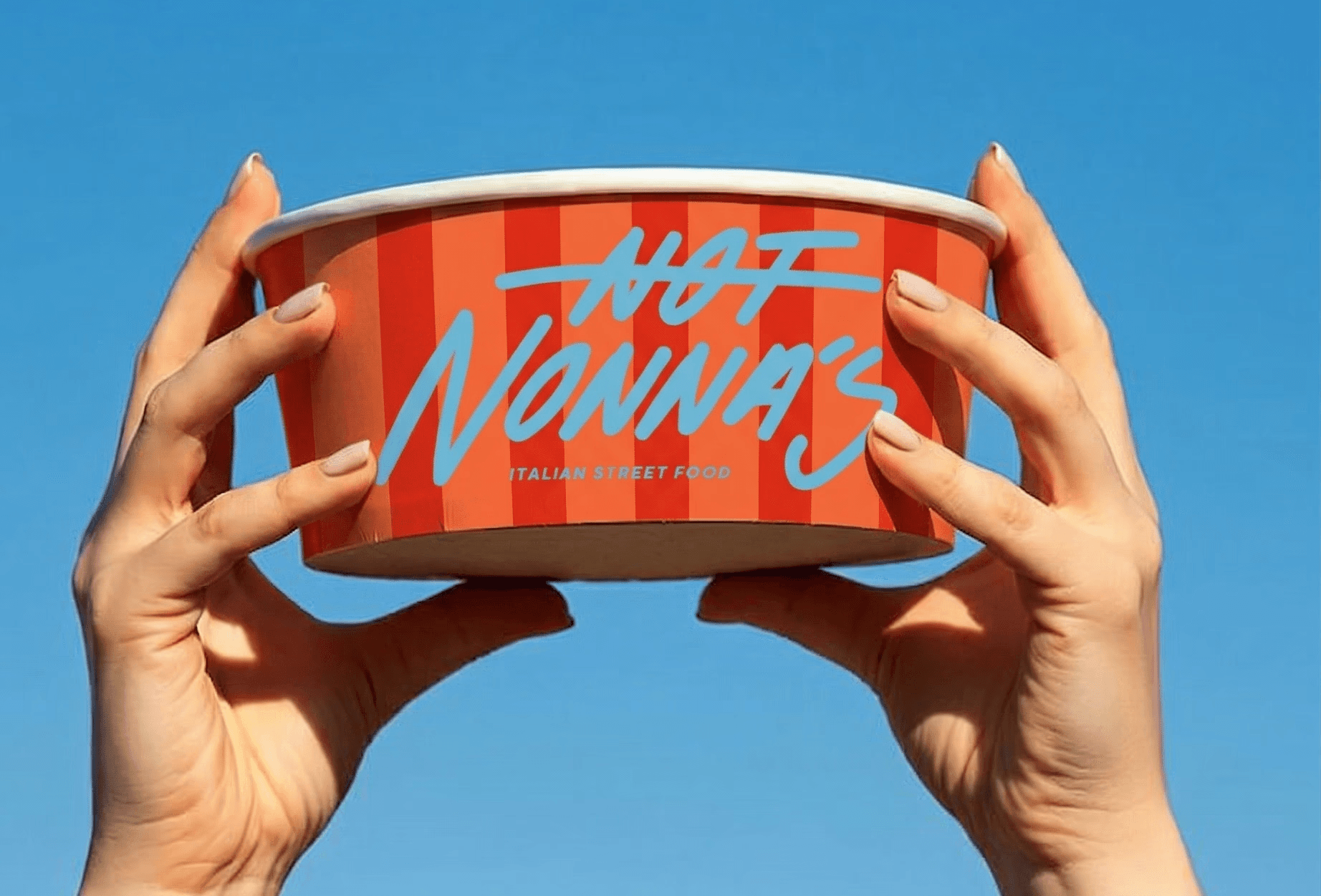 Minimalist coffee can design in hand – black and white packaging with bold typography