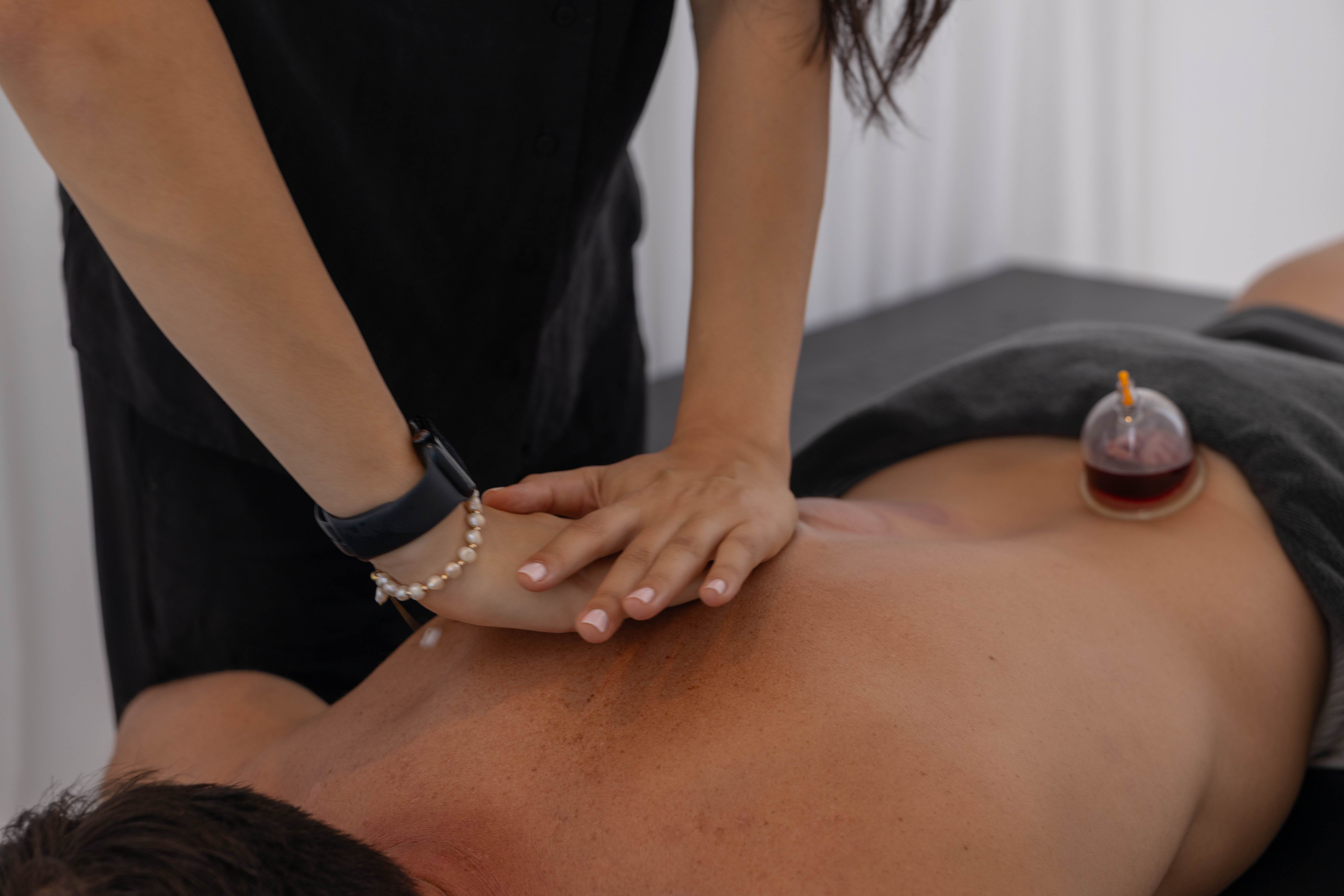 Rachel, personal trainer, looking to the side confidently in a fitness studio