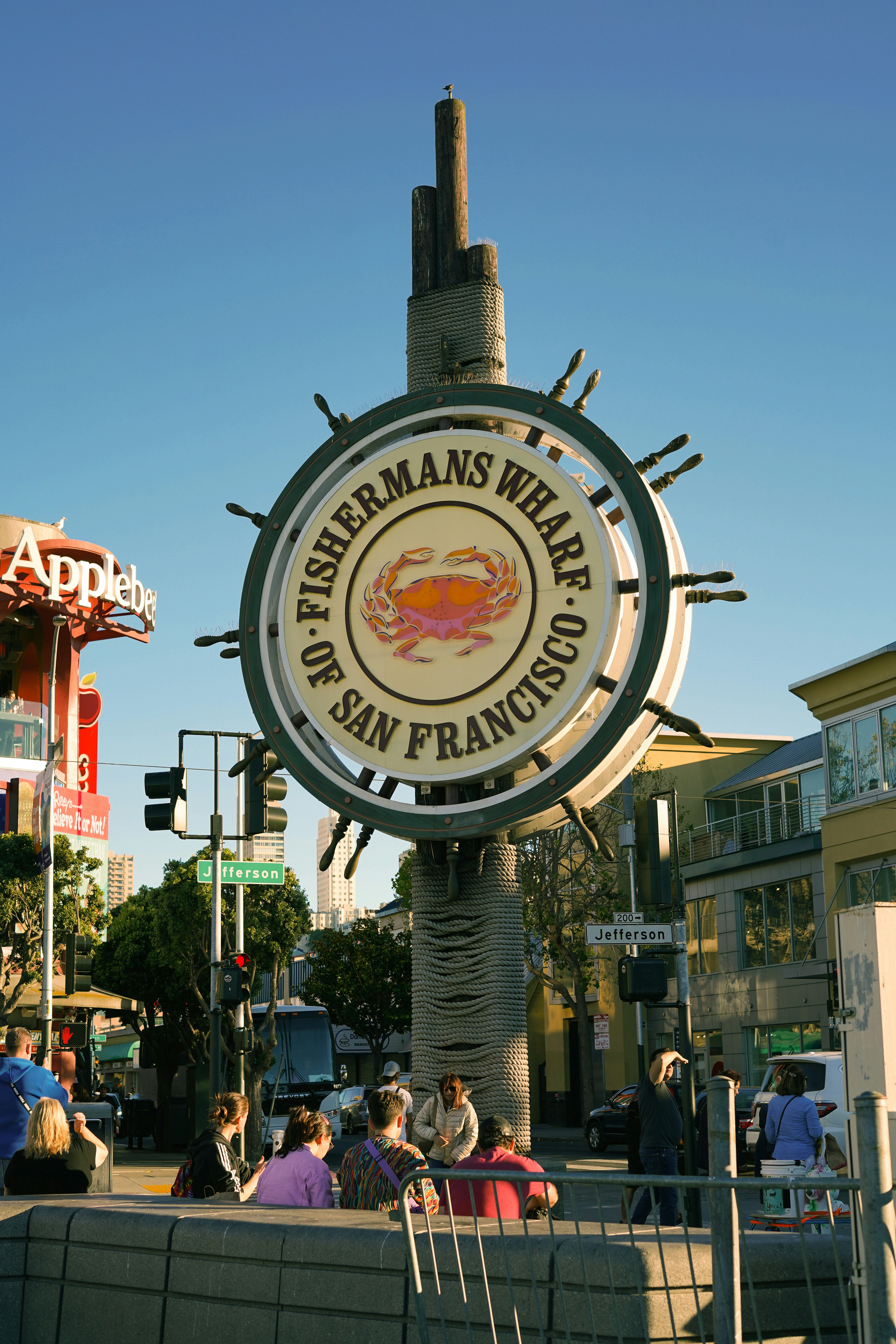 Iconic Fisherman's Wharf sign in San Francisco with a blue sky.