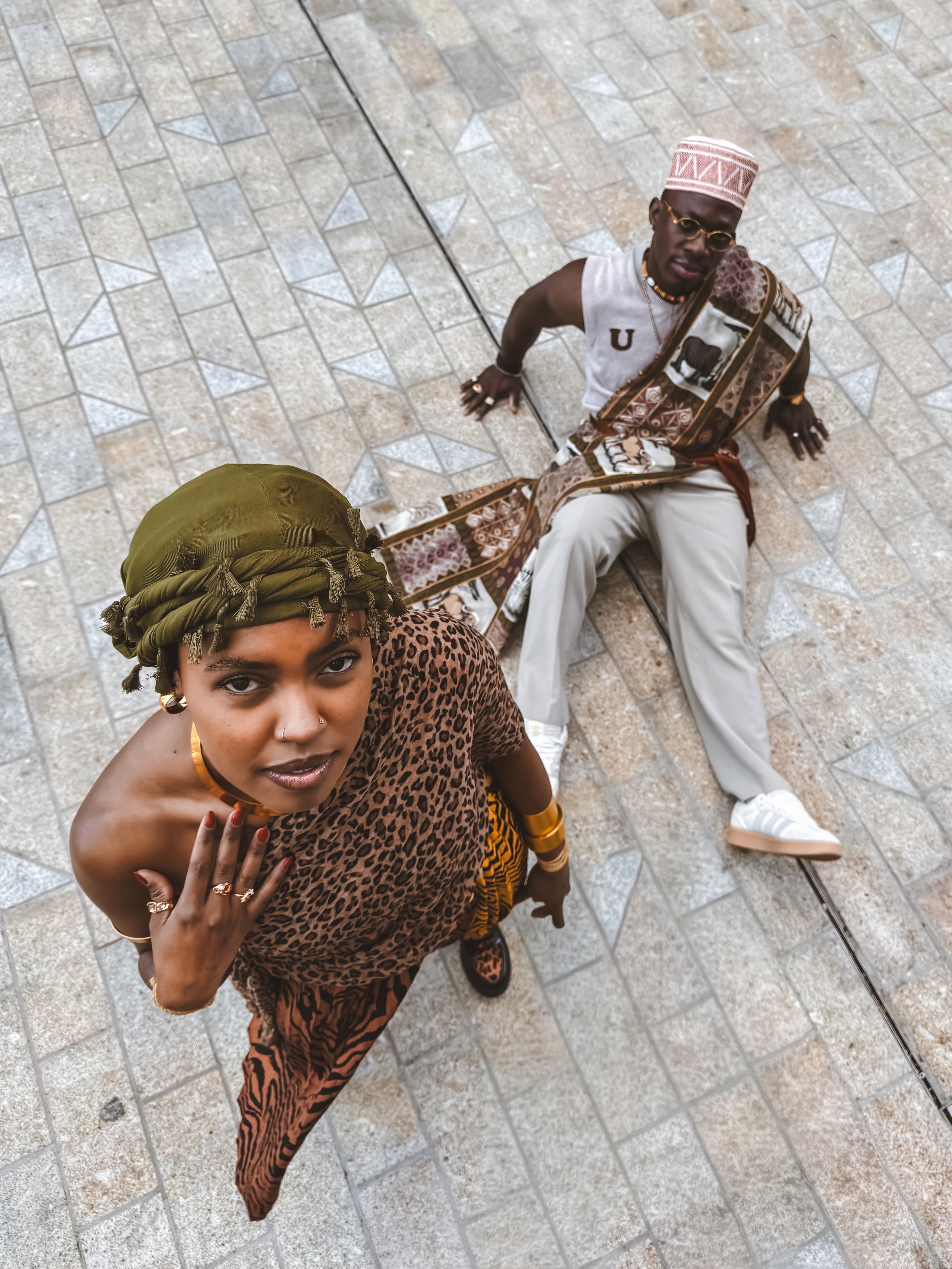 a woman in a dress sitting on a couch