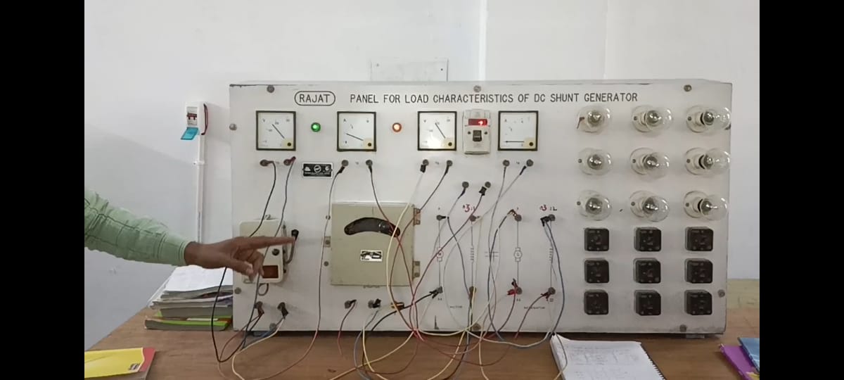 Full moon rising behind a house at night
