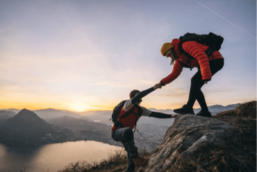 Mountberry guiding SMEs to business growth and success, offering support every step of the journey, like a hiker helping another up a mountain.