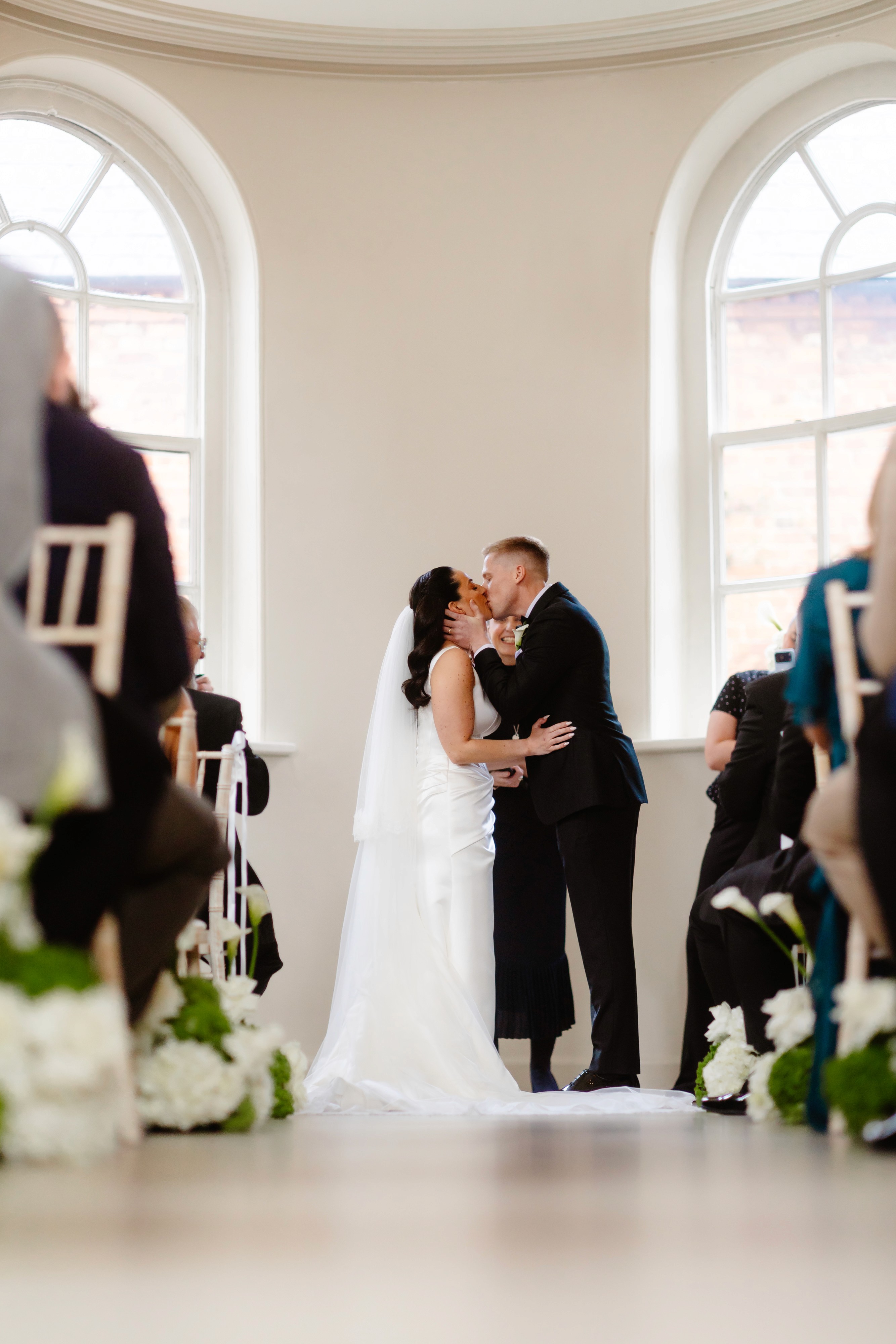 Olivia and Jake’s first kiss, seen from the back of Iscoyd Park’s ceremony room
