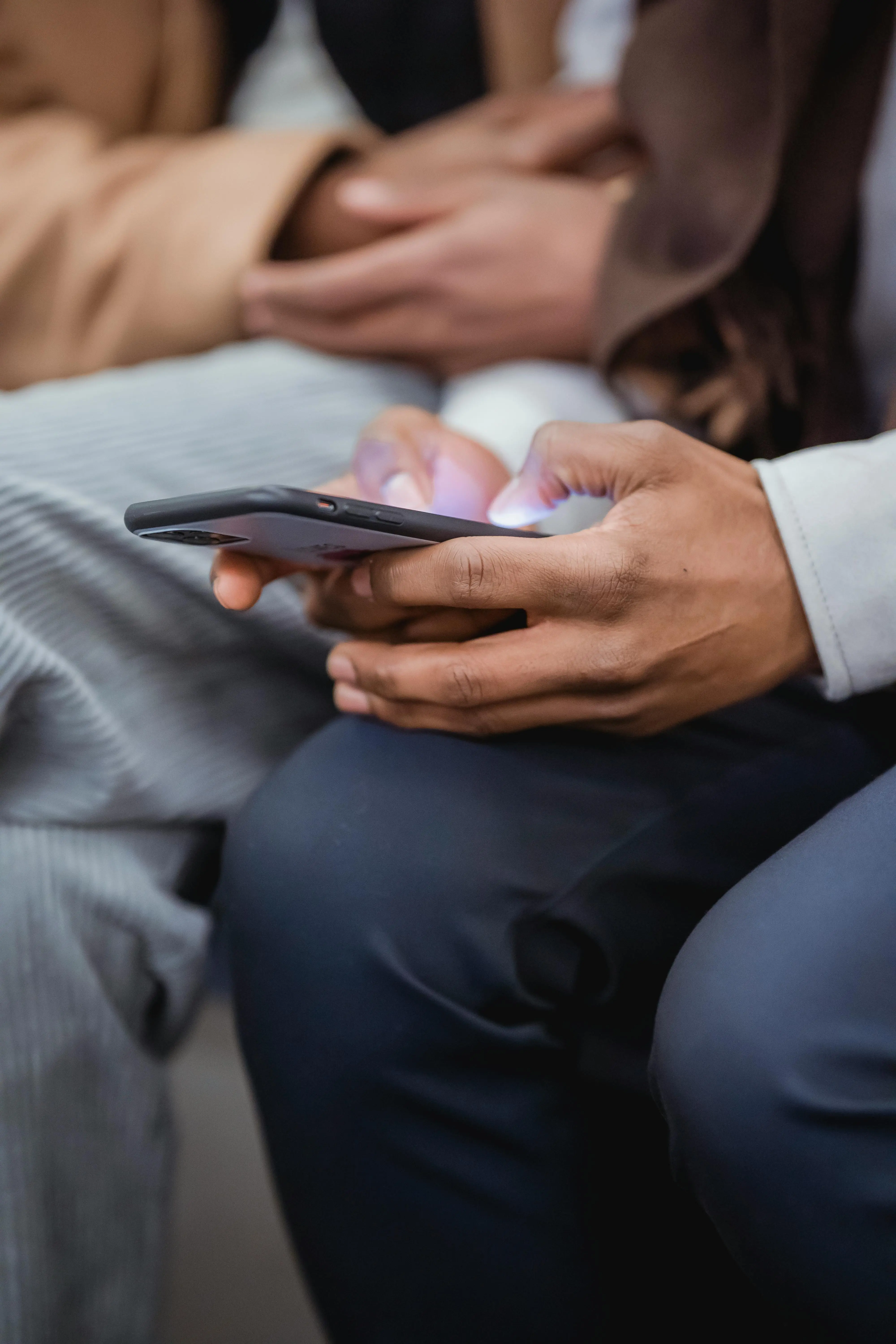 Person checking property information and messages on a smartphone