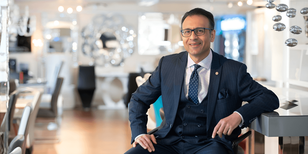 Asad Shamim, CEO of Furniture in Fashion, showcasing stylish, affordable home furniture in a modern, customer-centric showroom setting.