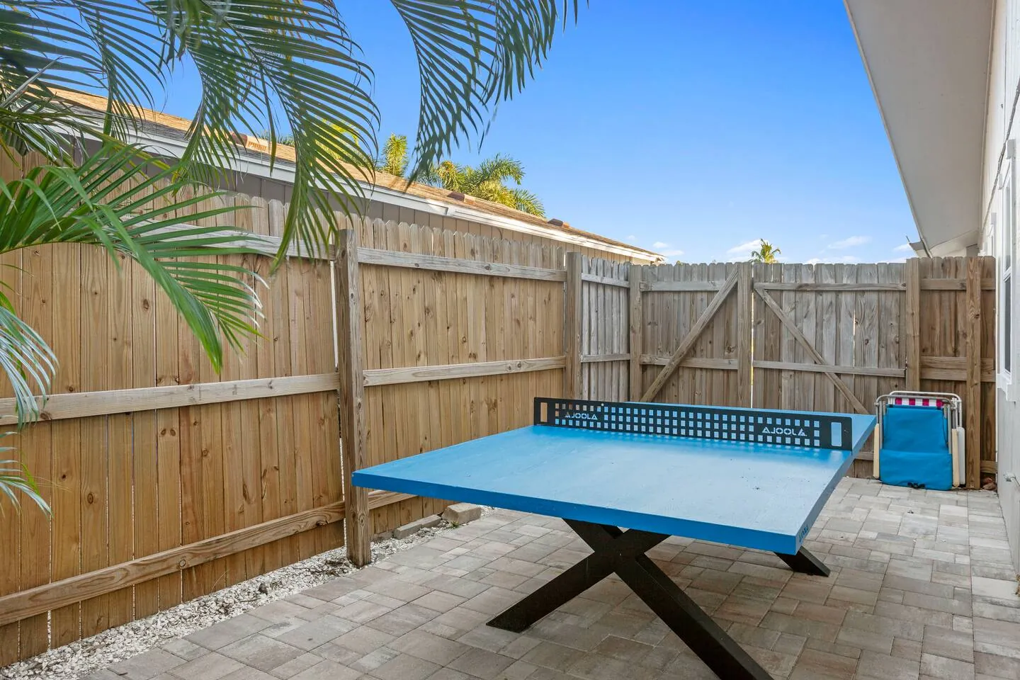 Outdoor ping pong table on side patio at Sarasota Beach Bungalow, Bradenton, Florida