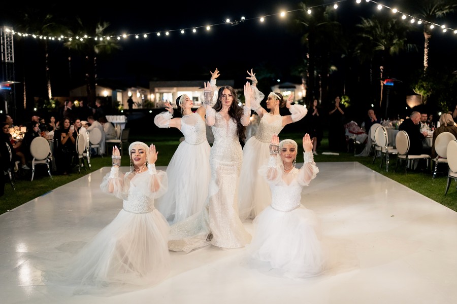 Feathered performers taking the floor at a reception