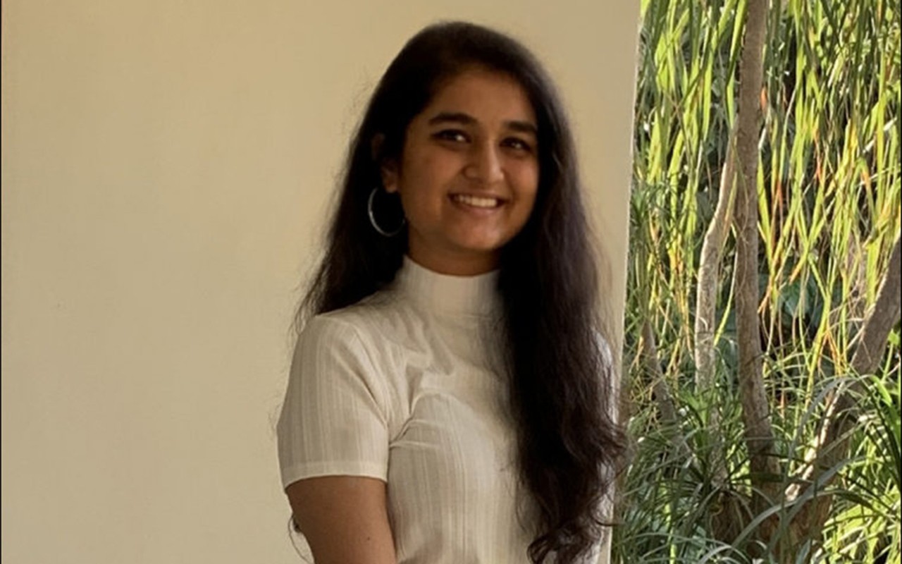 brunette woman in white clothes, student Vidhi Patel