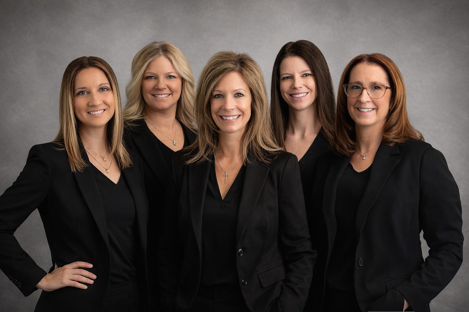 A group portrait of five smiling female physical therapists and staff members at Advantage Physical Therapy and Rehab.