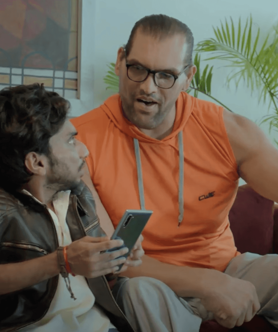 a person sitting on a couch with a laptop