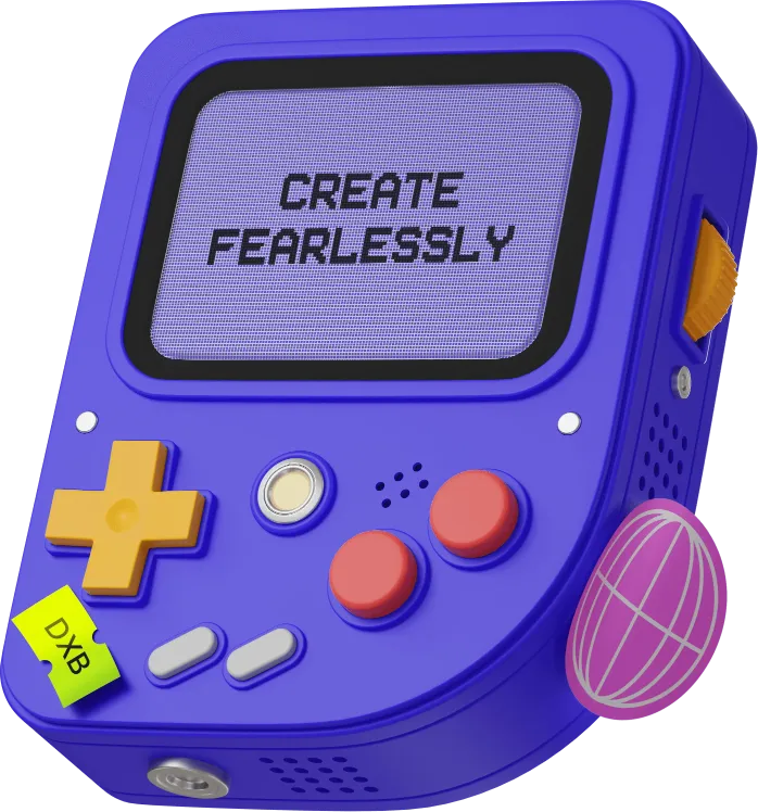 A blue retro handheld game console with the words "CREATE FEARLESSLY" on its screen. A small yellow game cartridge is inserted.