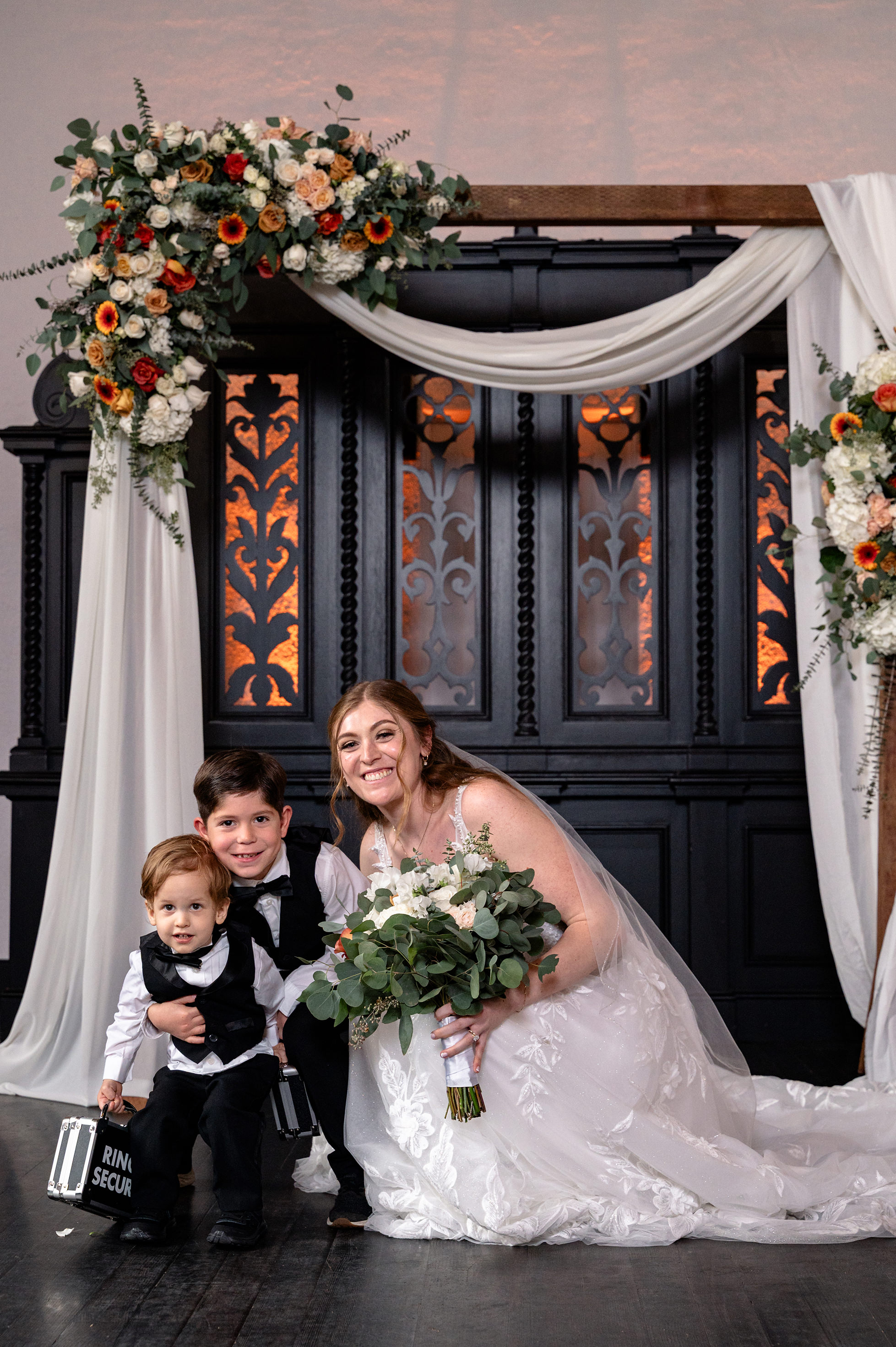 Flat lay wedding details with bouquet, rings, and sparkling bridal heels