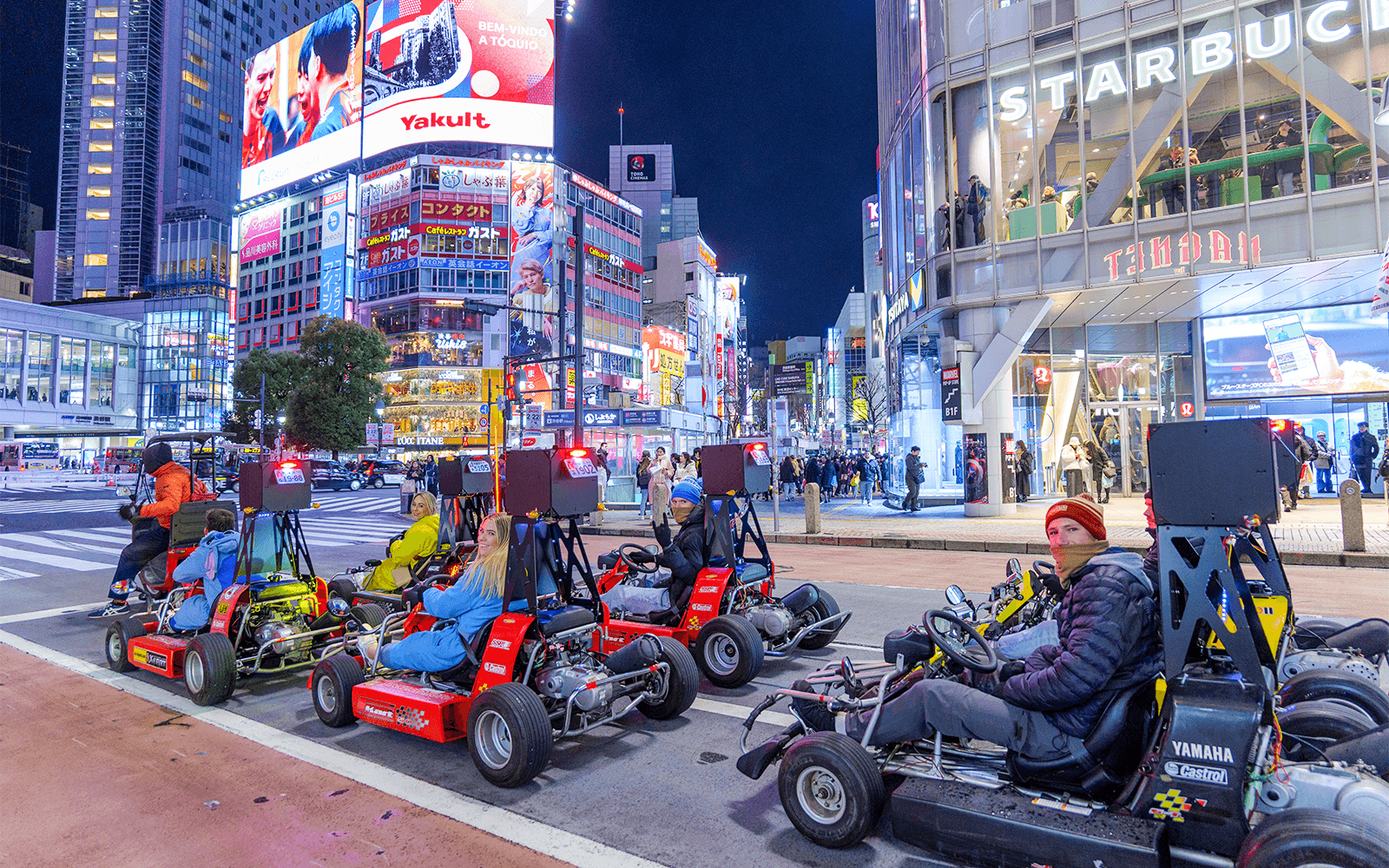 Nighttime go-karting track with illuminated karts racing in Dubai.