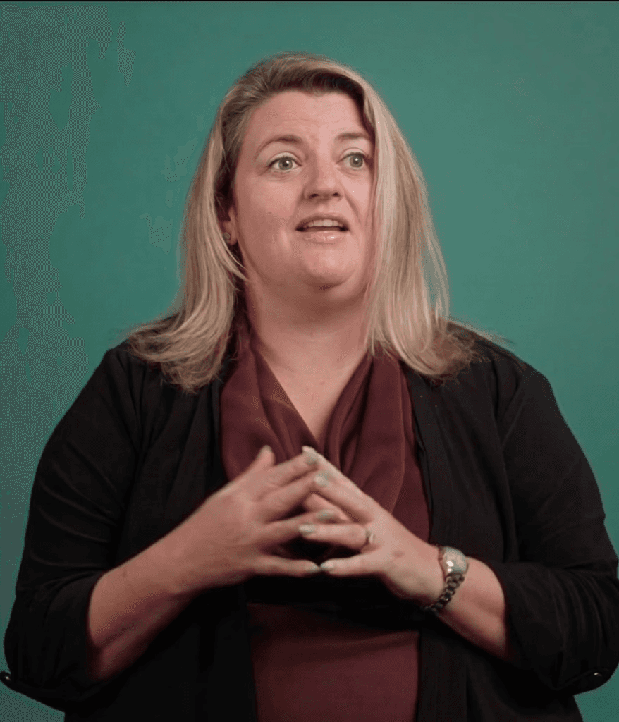 shallow focus photo of woman in gray jacket