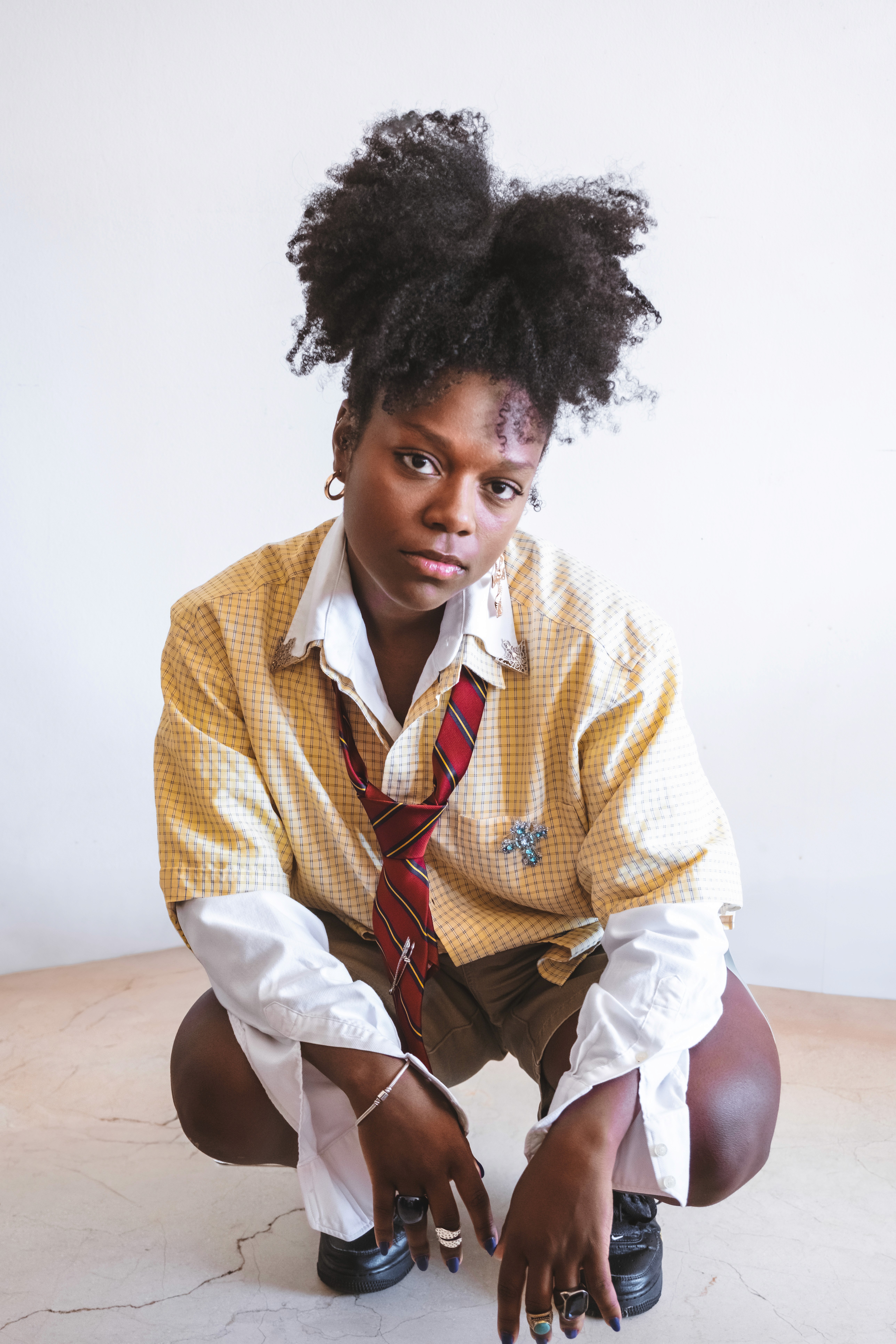 a woman in a dress sitting on a couch