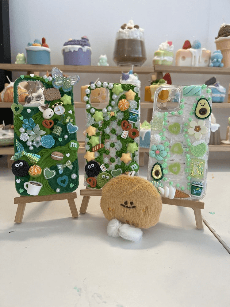 Cream gel art phone case creations from a DIY workshop in London