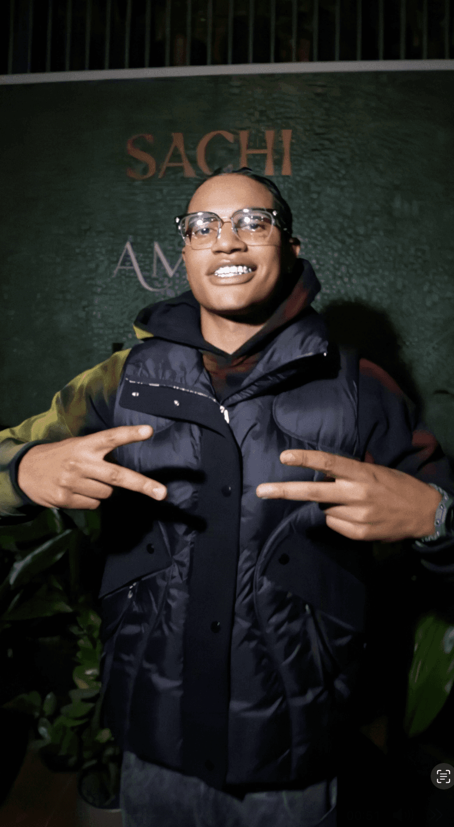 Bride and groom walking on street at night