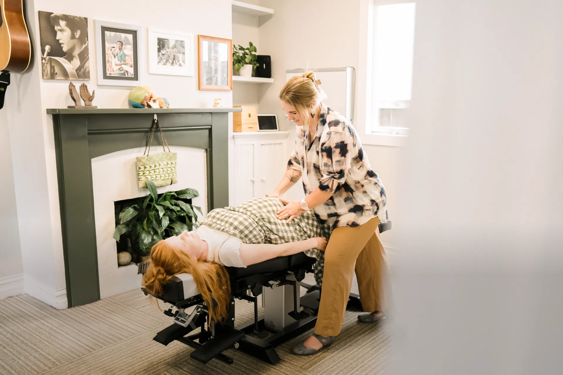 Pregnant Women getting chiropractic adjustment