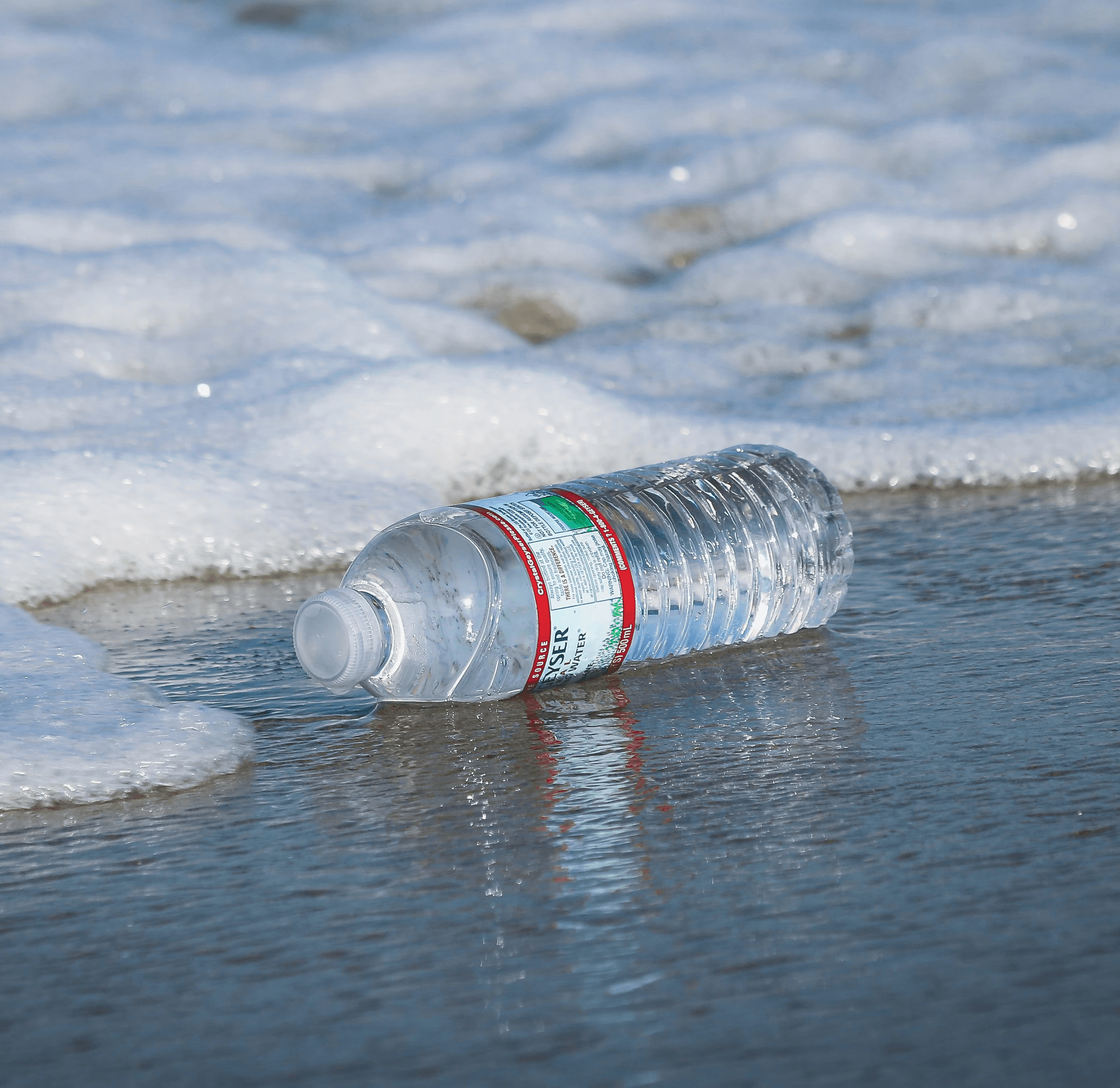 water plastic bottle on seashore