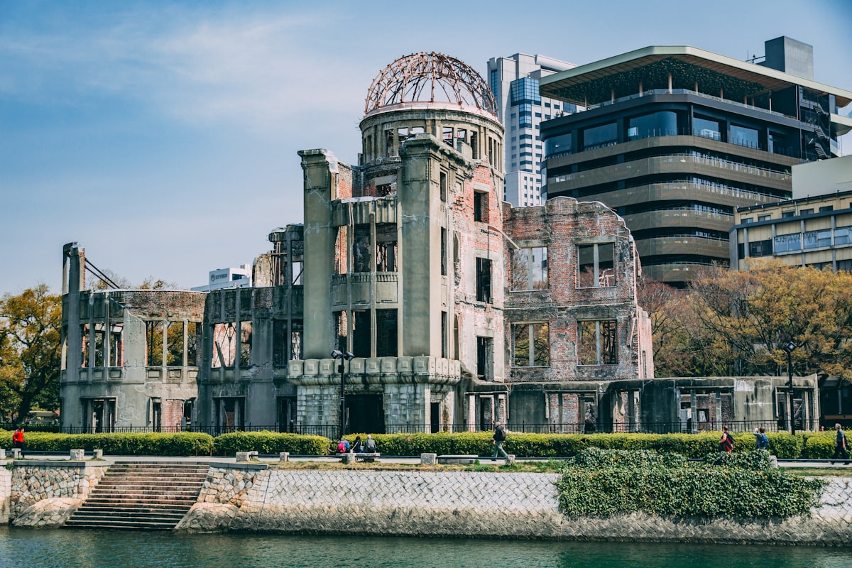 Atomic Bomb Dome standing in Hiroshima Peace Memorial Park surrounded by trees and the Motoyasu River