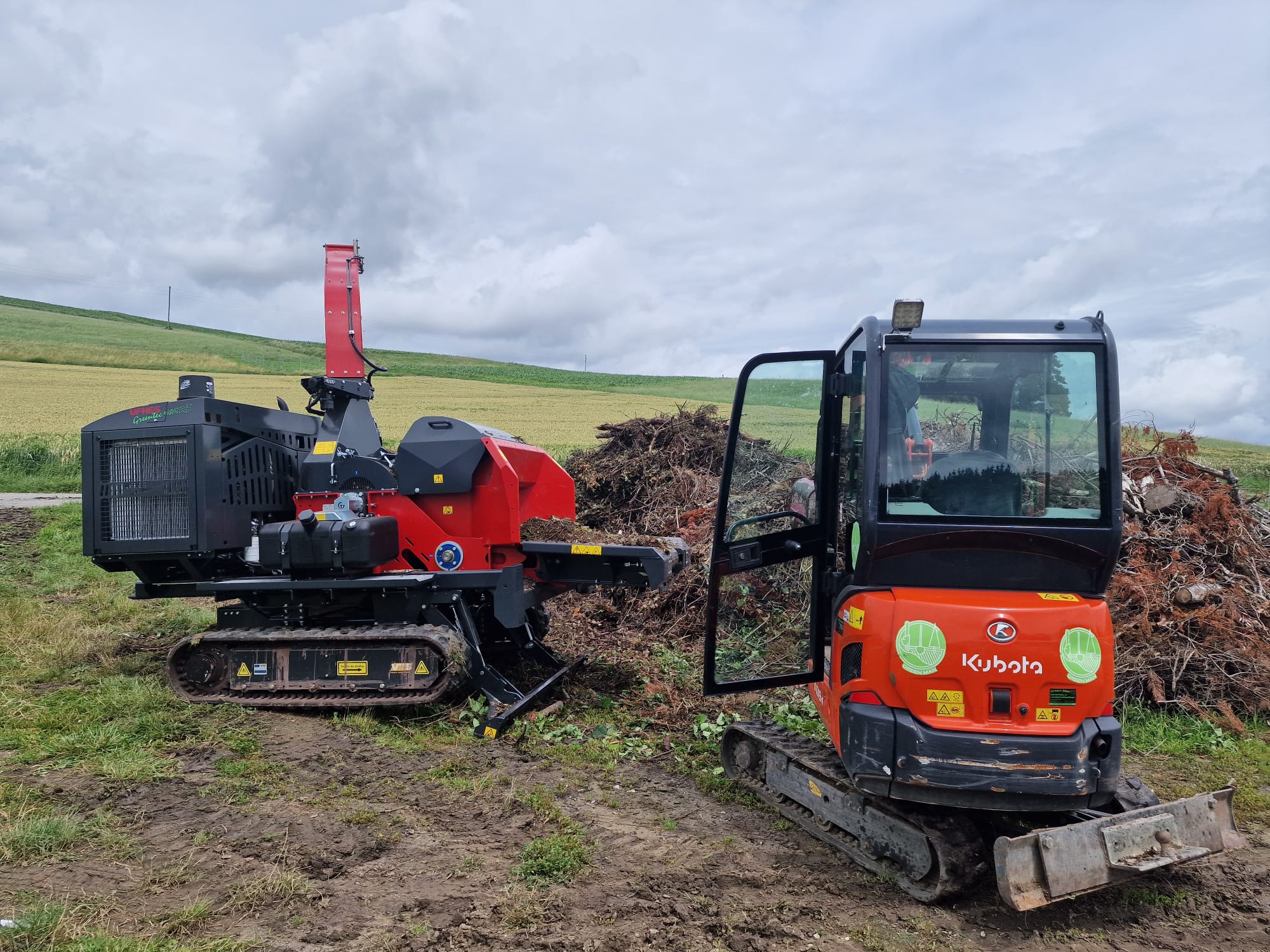 orange and white excavator on brown ground during daytime