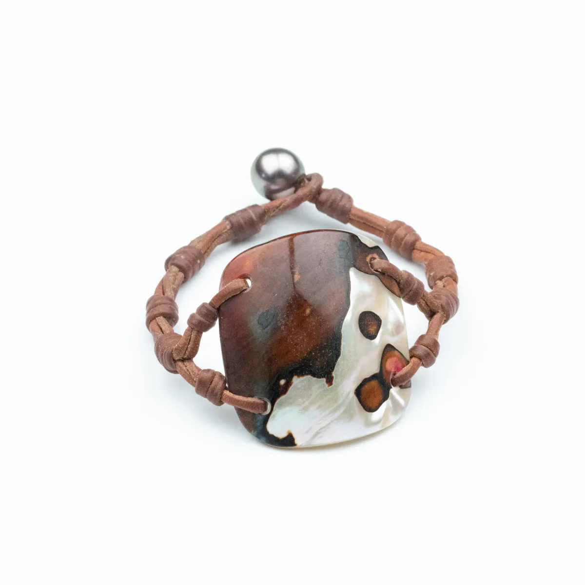 Seashell and Tahitian Pearl bracelet on hand-knotted brown leather cord with pearl toggle closure — Manos de Oro Saint Barth