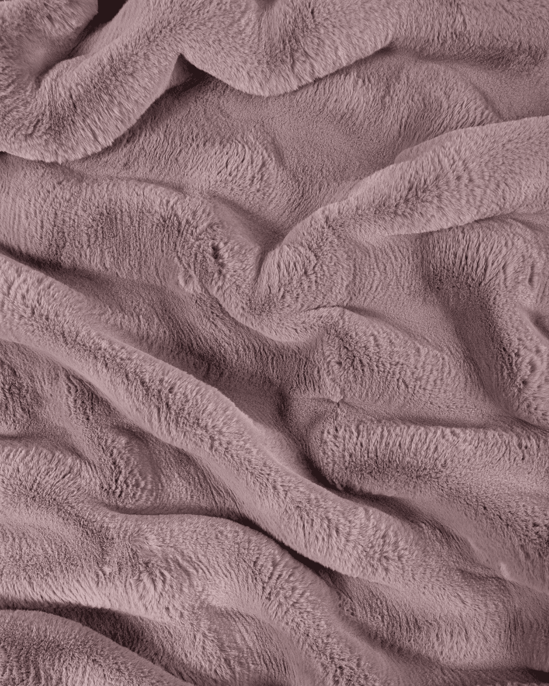 close up fabric shot of a dimensional faux fur blanket in lilac