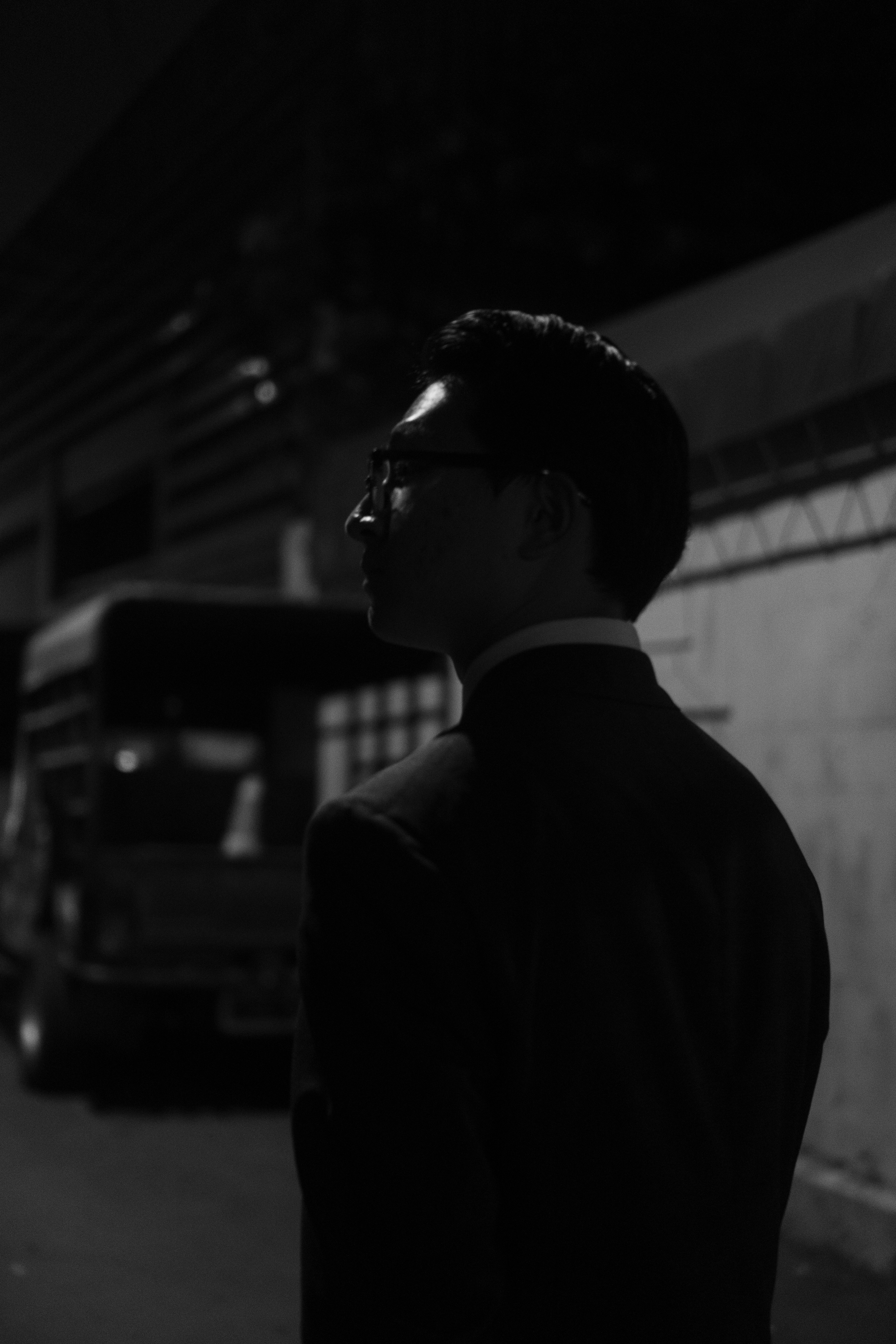 a blurry photo of a person standing in front of a wall