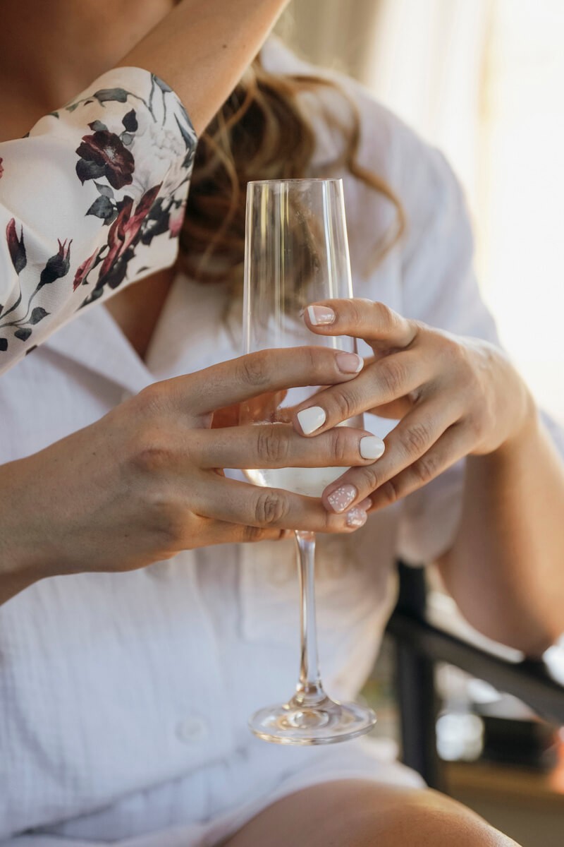 Close-up portrait of bride holding drink during Lombardini wedding morning