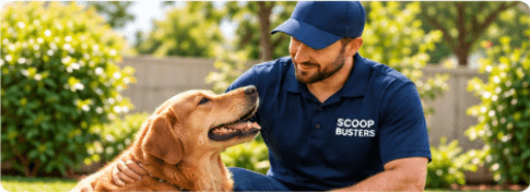 Scoop Busters pet waste removal team member with a happy dog