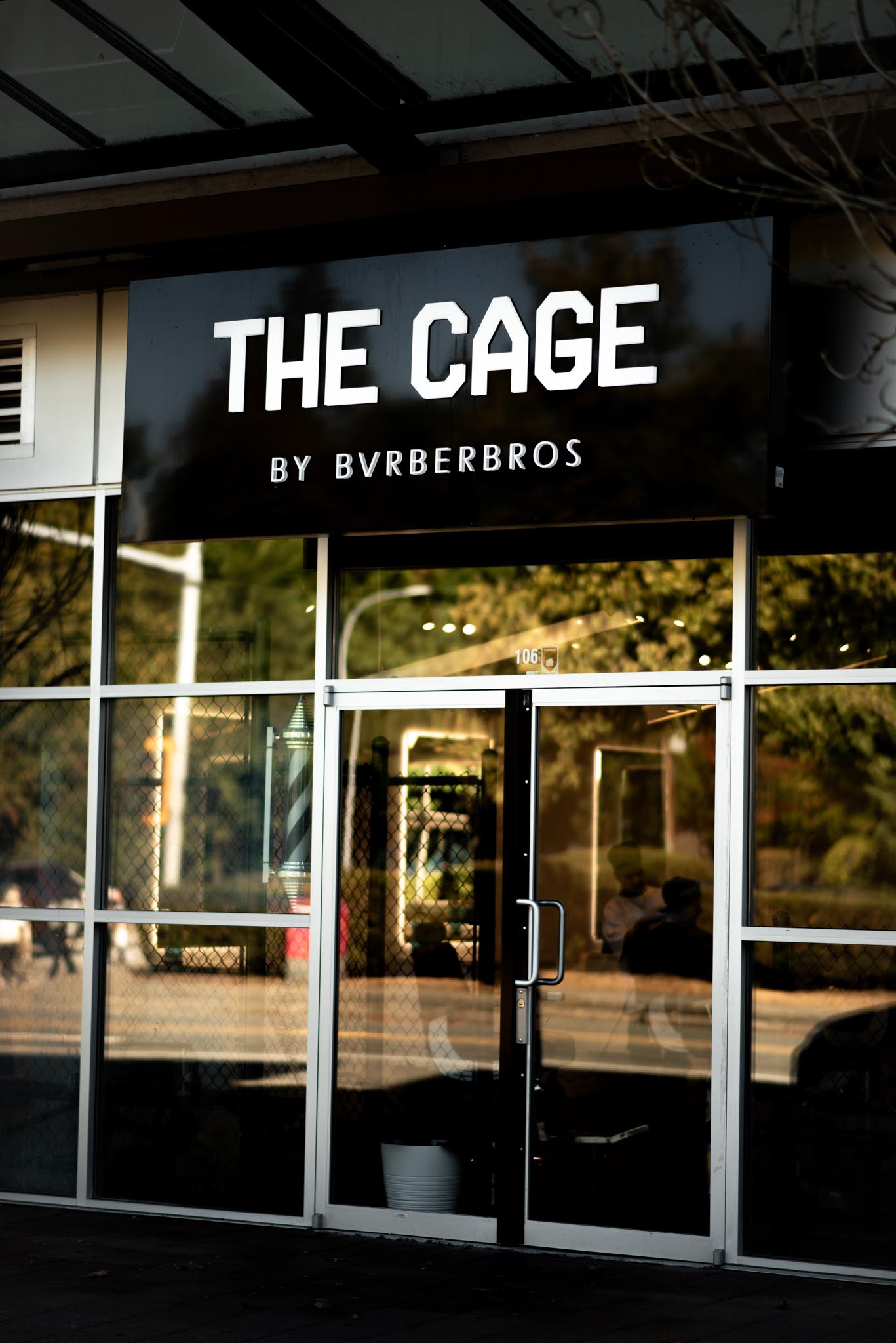 Golfer preparing to putt near a flag marked 32, with a golf ball and a CLUB EDGE water bottle on the green.