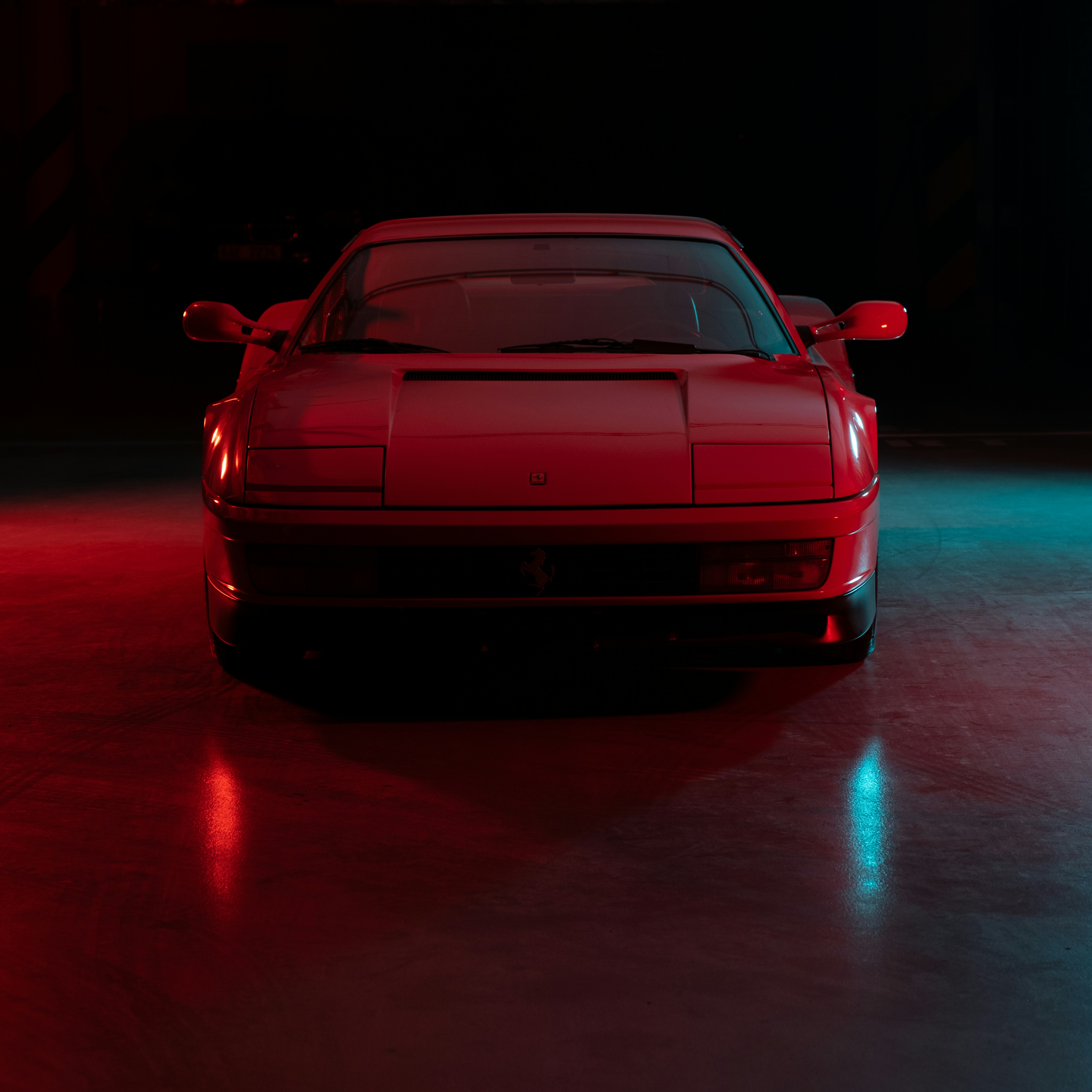 red car on road during night time