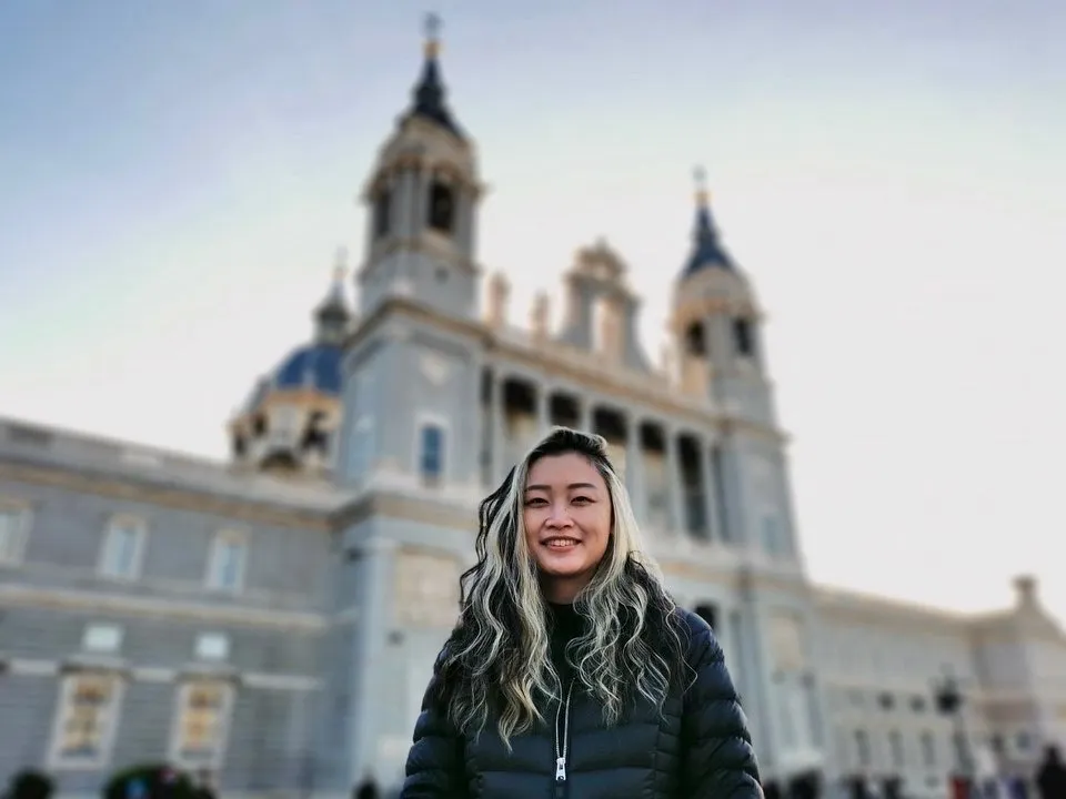 Tessa standing in front of a European building