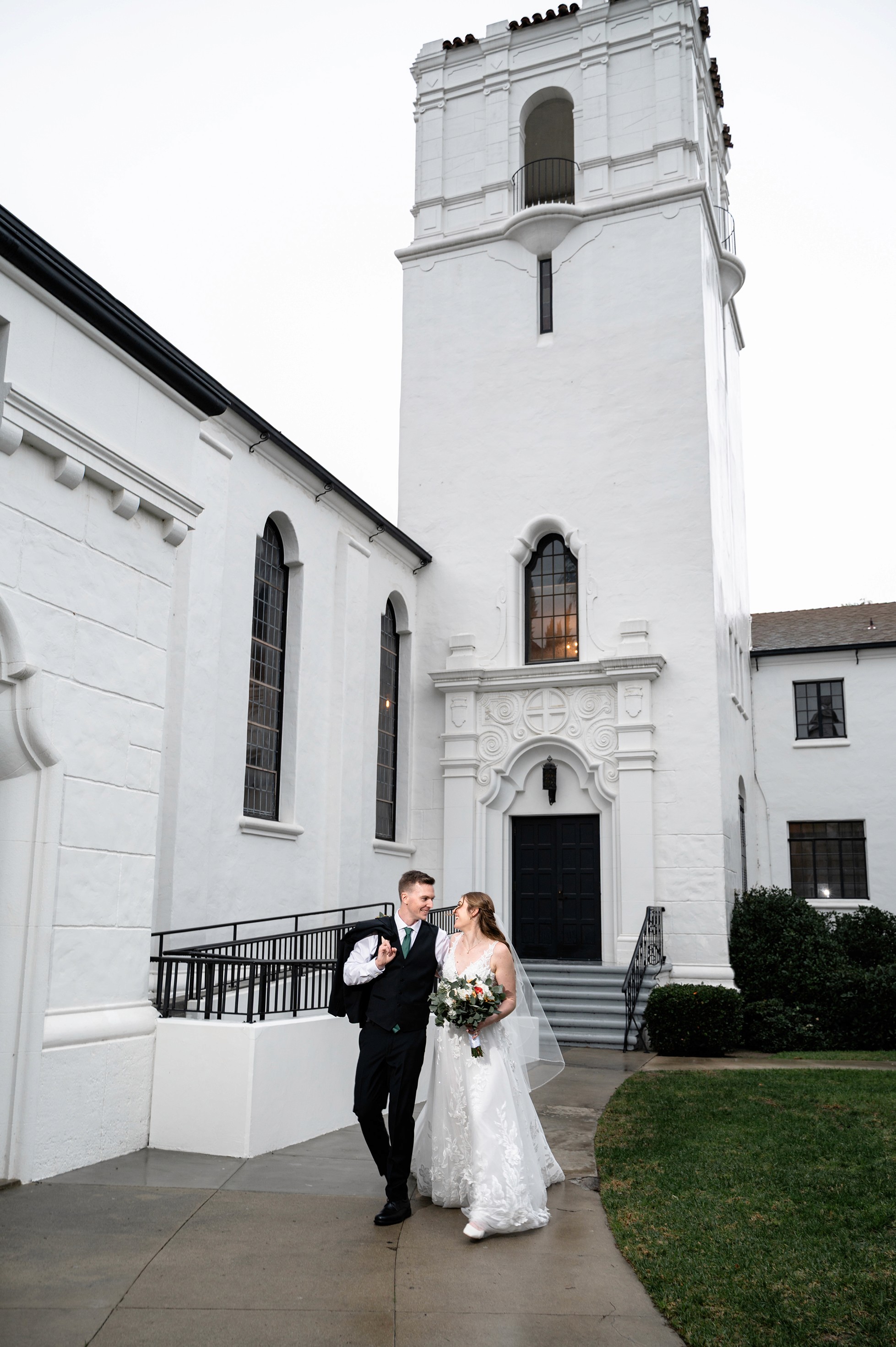 Flat lay wedding details with bouquet, rings, and sparkling bridal heels