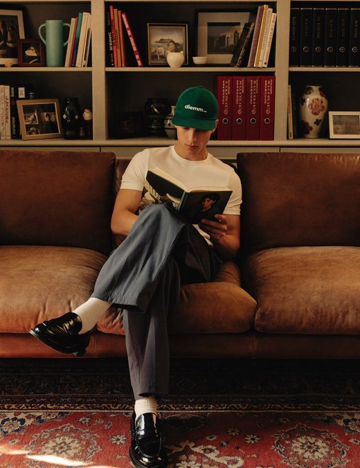 A person reading on a sofa
