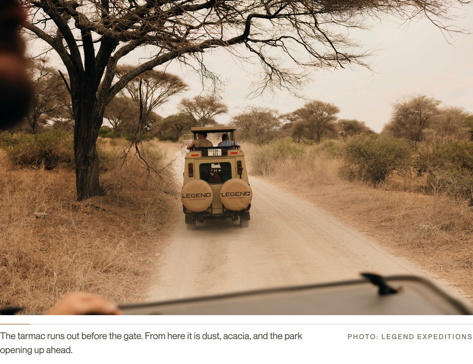 A Legend Expeditions Land Cruiser on a dusty track through the bush in Tarangire