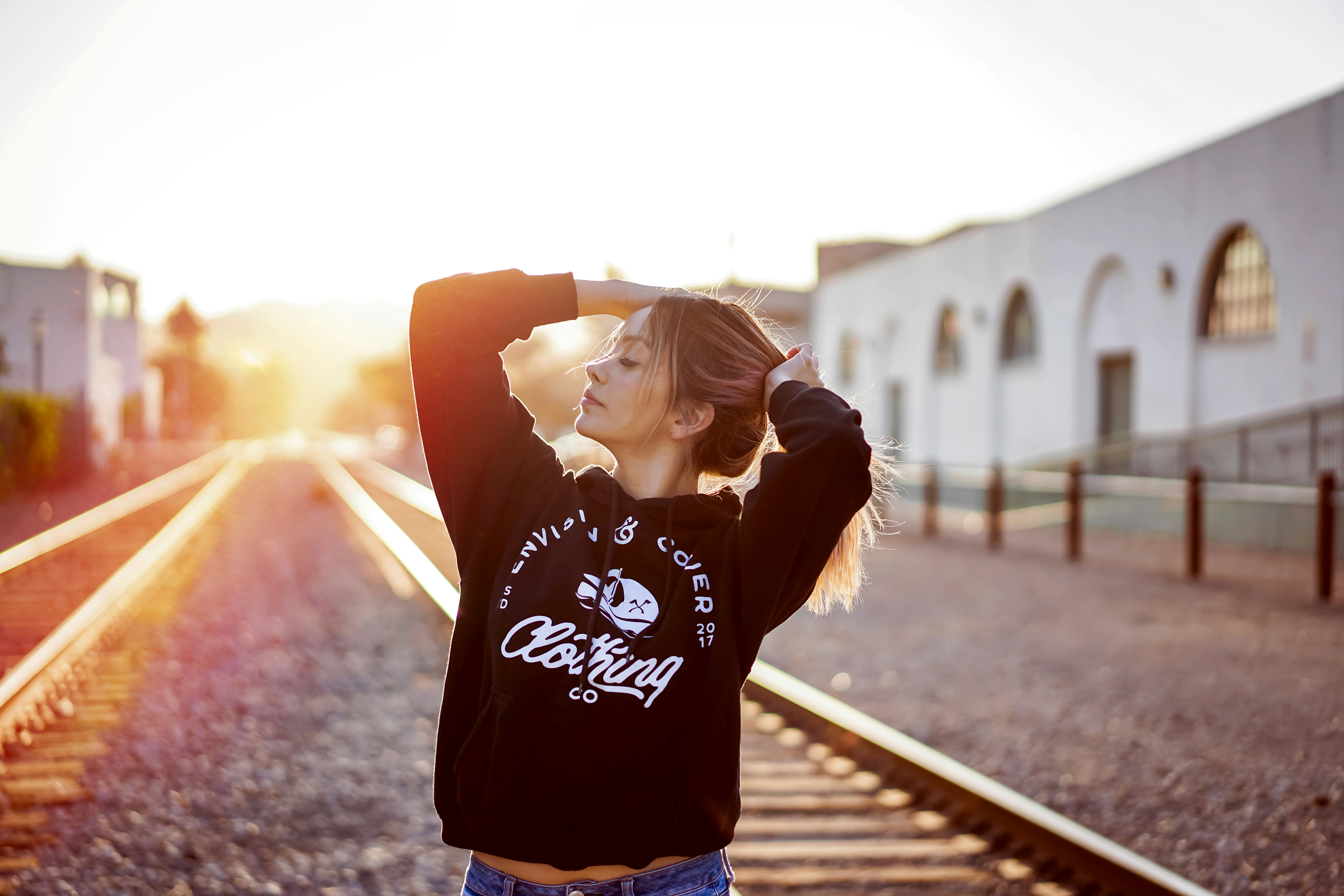 woman on railway track - Best Clothing Colors For Cool Skin Tone