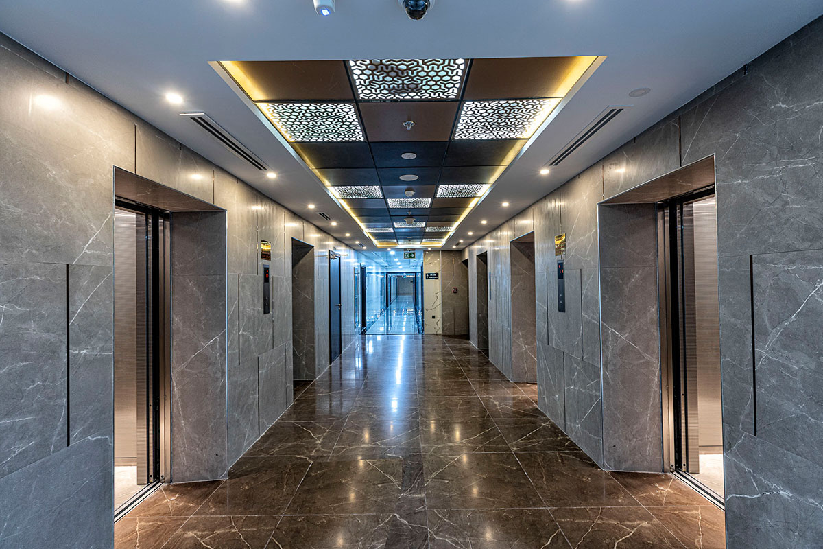 Modern elevator lobby in Geepas Tower showing high-end finishing for prospective property buyers.
