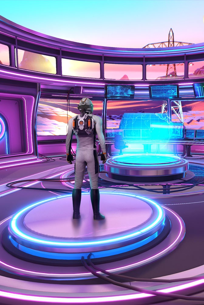 Close-up portrait of a person wearing a gray insulated hooded jacket with the hood up, showing their face framed by the hood against a light background.