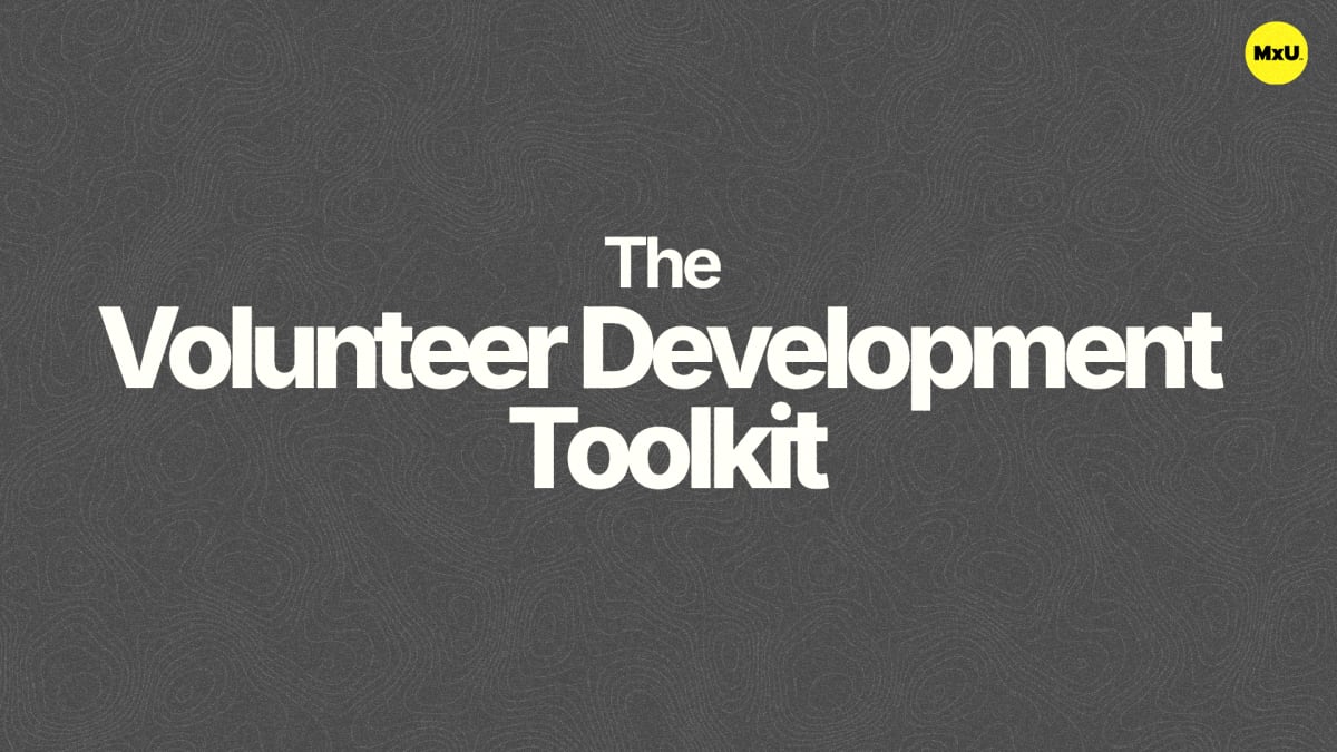 Cover image for the free MxU worship ministry resource, 'The Volunteer Development Toolkit,' featuring white title text on a gray textured background with a small yellow MxU logo in the top right corner.