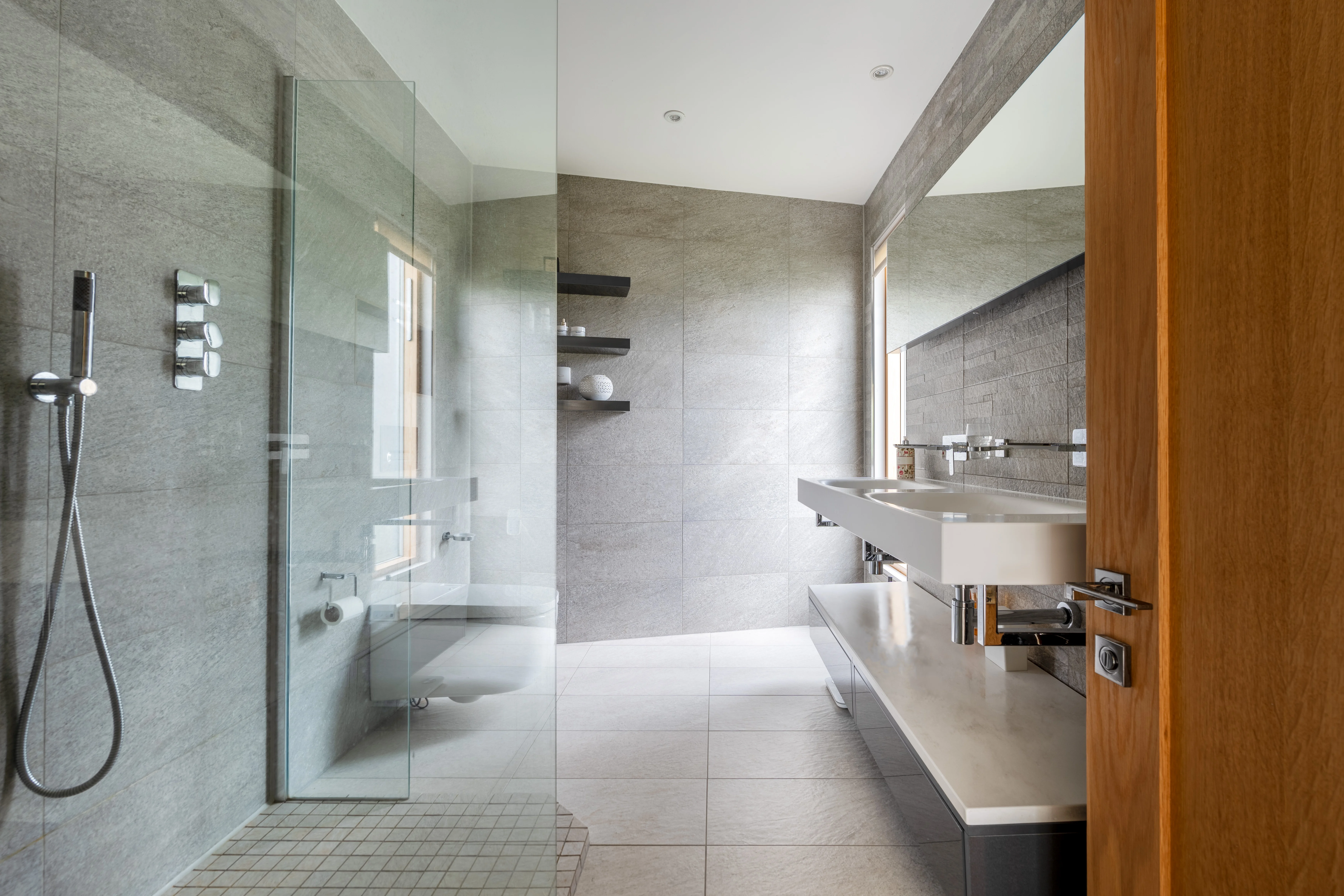 Modern bathroom at Stoodly Barn with walk-in shower and stone-effect tiling
