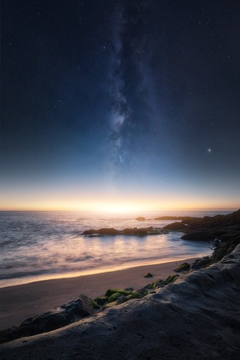 A still lake with mountains in the distance