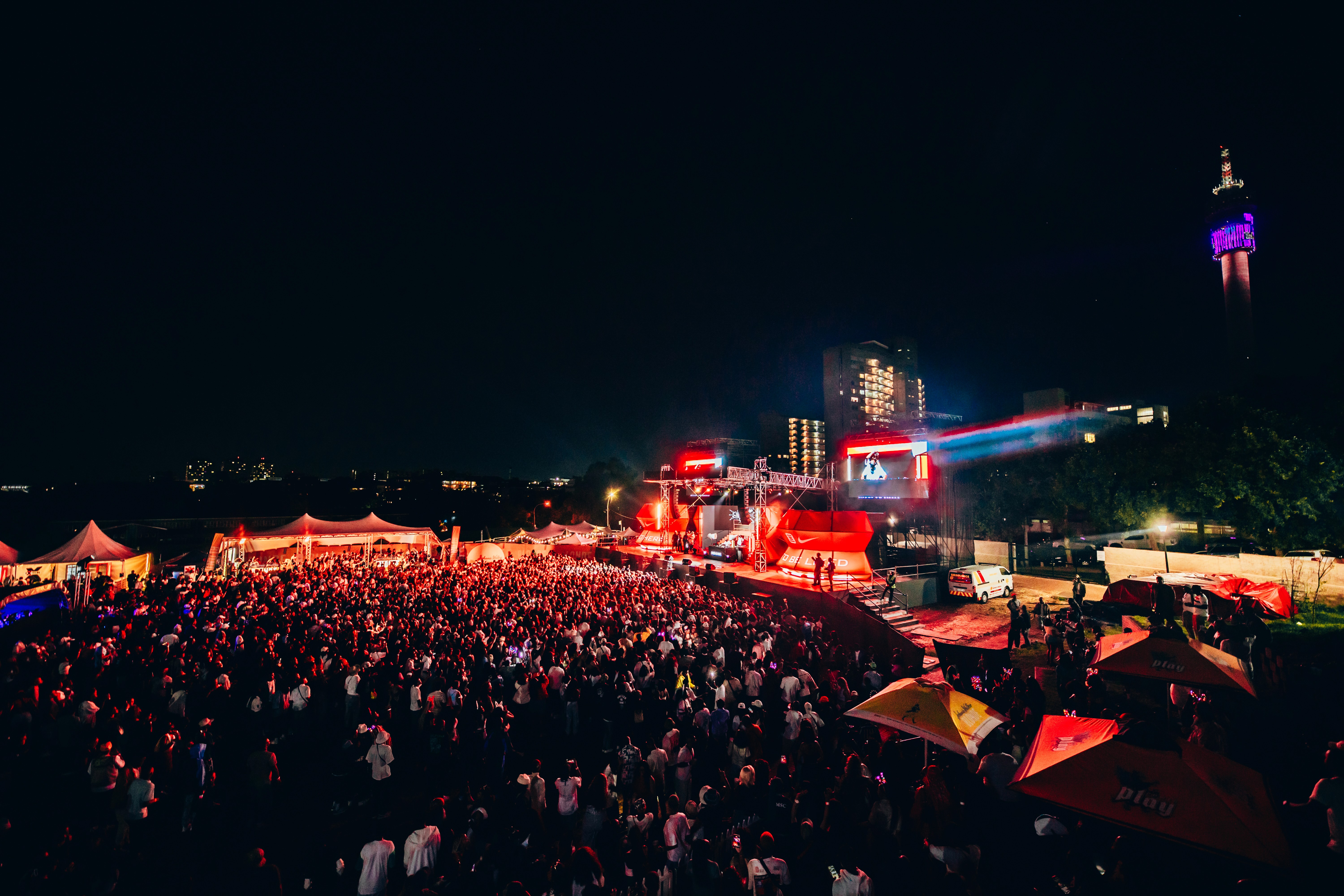 a woman holding a red flower