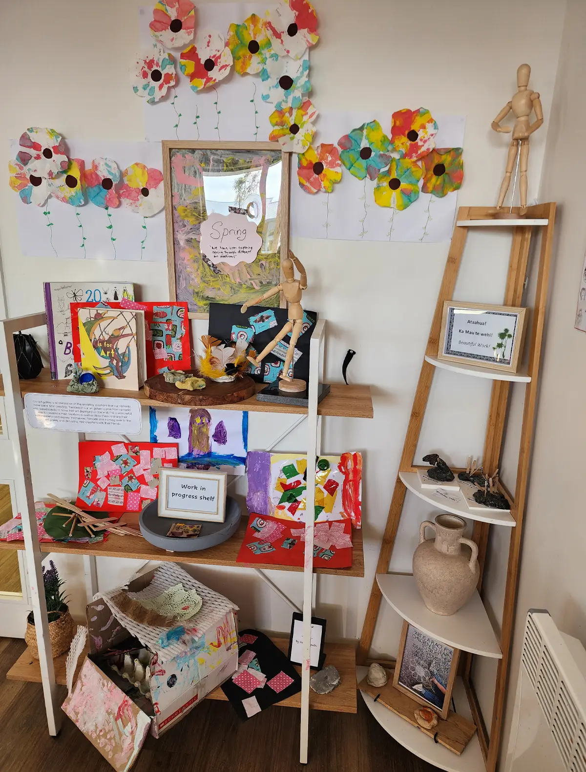 Young children engage in supervised water play with a teacher in an outdoor early childhood environment.