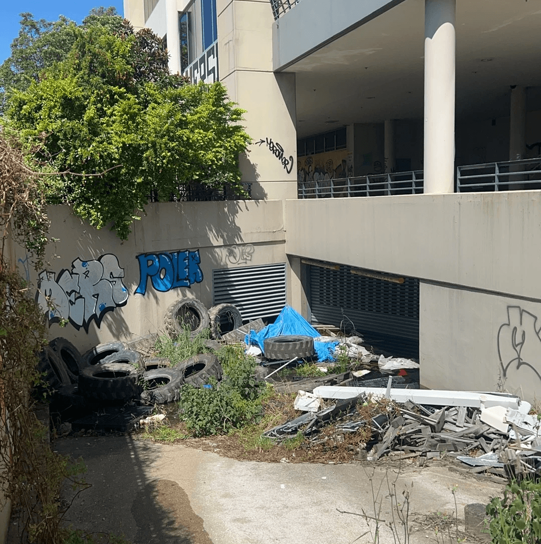 A pile of trash at a underutilised site